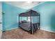 Cozy bedroom featuring a bunk bed, plush carpeting, and a bright turquoise paint at 1232 Candler Ct, Morrow, GA 30260