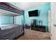 Bedroom boasts a bunk bed, TV, mini fridge, and neutral color carpeting at 1232 Candler Ct, Morrow, GA 30260
