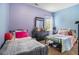Inviting bedroom features comfortable beds, a window, and neutral-toned walls at 1232 Candler Ct, Morrow, GA 30260