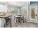 Charming dining area with pendant lighting and view to backyard at 1232 Candler Ct, Morrow, GA 30260