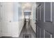Inviting entryway with wood flooring, wainscoting, and a view into the open-concept living space at 1232 Candler Ct, Morrow, GA 30260