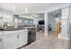 Open-concept kitchen with stainless steel appliances and views to living room at 1232 Candler Ct, Morrow, GA 30260