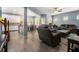 Open-concept living room featuring wood floors, modern furnishings, and seamless flow to the kitchen at 1232 Candler Ct, Morrow, GA 30260