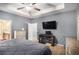 Relaxing bedroom features cozy carpet, flat-screen tv, and en-suite bathroom at 1232 Candler Ct, Morrow, GA 30260