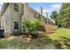 View of the home's backyard featuring a patio and partial wooden fencing at 4221 Rogers Creek Ct, Duluth, GA 30096