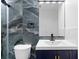 Stylish bathroom features stone accent wall in shower, modern fixtures, and a sleek vanity at 4221 Rogers Creek Ct, Duluth, GA 30096