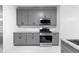 Modern kitchen featuring stainless steel appliances, granite countertops and ample cabinet space for storage at 4221 Rogers Creek Ct, Duluth, GA 30096