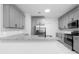 Modern kitchen featuring stainless steel appliances, granite countertops and ample cabinet space for storage at 4221 Rogers Creek Ct, Duluth, GA 30096