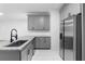 Modern kitchen featuring stainless steel appliances, granite countertops and ample cabinet space for storage at 4221 Rogers Creek Ct, Duluth, GA 30096