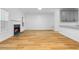 Spacious living room featuring a fireplace, hardwood floors, and neutral decor at 4221 Rogers Creek Ct, Duluth, GA 30096