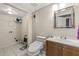 Bathroom featuring tile floors, modern toilet and vanity, and large mirror at 4672 Satellite Blvd, Duluth, GA 30096