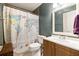 Cozy bathroom featuring a large mirror and a world map shower curtain at 4672 Satellite Blvd, Duluth, GA 30096