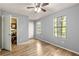 Comfortable bedroom featuring wood floors and a bright window for natural lighting at 4672 Satellite Blvd, Duluth, GA 30096