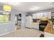 Bright kitchen with white cabinets, light countertops, and stainless steel appliances at 4672 Satellite Blvd, Duluth, GA 30096