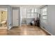 Open living area showcasing wood floors and a staircase leading to the upper level at 4672 Satellite Blvd, Duluth, GA 30096