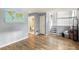 Open living area showcasing wood floors and a staircase leading to the upper level at 4672 Satellite Blvd, Duluth, GA 30096