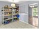 Well lit pantry and dining room featuring white wall paint and tile floors at 4672 Satellite Blvd, Duluth, GA 30096