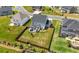 Spacious backyard featuring a stone fireplace, covered patio and well-kept lawn and privacy fence at 916 Gambino Trce, Peachtree City, GA 30269