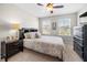 Comfortable bedroom features queen size bed, dark wood furniture, and natural light at 916 Gambino Trce, Peachtree City, GA 30269