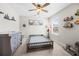 Charming bedroom featuring a ceiling fan and natural light from the window at 916 Gambino Trce, Peachtree City, GA 30269