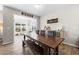Dining room with large wood table, bench seating, and decorative wall accents at 916 Gambino Trce, Peachtree City, GA 30269
