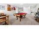 Large game room with a billiard table, accent furniture, and neutral carpet at 916 Gambino Trce, Peachtree City, GA 30269