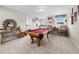 Spacious game room features pool table, ample seating, and decorative decor at 916 Gambino Trce, Peachtree City, GA 30269