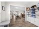 Open floorplan showcasing kitchen, dining, and living area with abundant natural light and modern flooring at 916 Gambino Trce, Peachtree City, GA 30269