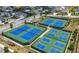 Enjoy the great outdoors on these well-maintained tennis courts with beautiful blue and green colors at 916 Gambino Trce, Peachtree City, GA 30269