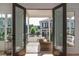 Cozy outdoor balcony with wicker furniture and view of the neighborhood at 100 Villa Magnolia Ln, Alpharetta, GA 30009
