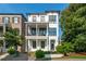 Beautiful white modern home with dual front porches and manicured landscaping at 100 Villa Magnolia Ln, Alpharetta, GA 30009