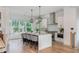 Modern kitchen featuring an oversized island, stainless appliances, and custom cabinetry at 100 Villa Magnolia Ln, Alpharetta, GA 30009