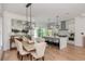 Open-concept kitchen with a large island, stainless steel appliances, and an adjacent dining area at 100 Villa Magnolia Ln, Alpharetta, GA 30009