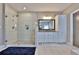 Spa-like bathroom featuring a walk-in shower with a glass surround, a double vanity, and tiled floors at 13015 Fox Rd, Alpharetta, GA 30005