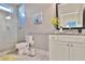 Modern bathroom with glass shower, granite countertop, and white vanity at 13015 Fox Rd, Alpharetta, GA 30005