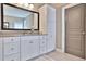 Bathroom with a large vanity with double sink, a large mirror, and tiled floors at 13015 Fox Rd, Alpharetta, GA 30005