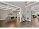 Elegant dining room featuring coffered ceilings, hardwood floors, and modern decor at 13015 Fox Rd, Alpharetta, GA 30005