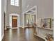 Grand foyer featuring high ceilings, hardwood floors, and elegant décor at 13015 Fox Rd, Alpharetta, GA 30005