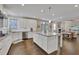 Spacious kitchen with stainless steel appliances, granite counters, a large island and an open design at 13015 Fox Rd, Alpharetta, GA 30005
