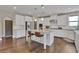 Spacious kitchen features a large island, stainless steel appliances, and white cabinetry at 13015 Fox Rd, Alpharetta, GA 30005