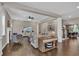 Bright living room with hardwood floors, fireplace, and open access to other living areas at 13015 Fox Rd, Alpharetta, GA 30005