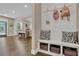 Mudroom with bench, storage baskets, and coat hooks near the entrance of the house at 13015 Fox Rd, Alpharetta, GA 30005