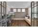 A well-lit office space with hardwood floors and modern furnishings at 13015 Fox Rd, Alpharetta, GA 30005