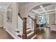 Beautiful staircase with hardwood steps and white railing, leading to the upper level at 13015 Fox Rd, Alpharetta, GA 30005