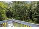 Relax on the back porch, surrounded by a lush, green forest at 3514 Blackberry Se Ln, Conyers, GA 30094