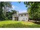 Expansive backyard featuring lush greenery, a deck, and the home's exterior at 3514 Blackberry Se Ln, Conyers, GA 30094
