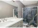Bathroom with marble-themed shower curtain, a sink, and a mirror at 3514 Blackberry Se Ln, Conyers, GA 30094