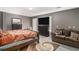 Spacious bedroom featuring hard wood floors, flat screen TV and a comfortable sitting area at 3514 Blackberry Se Ln, Conyers, GA 30094