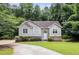 Charming one-story home featuring a well-manicured lawn, mature trees, and a welcoming front entrance at 3514 Blackberry Se Ln, Conyers, GA 30094