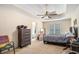 Main bedroom with a ceiling fan, neutral walls, a gray bedspread, and carpet flooring at 3514 Blackberry Se Ln, Conyers, GA 30094